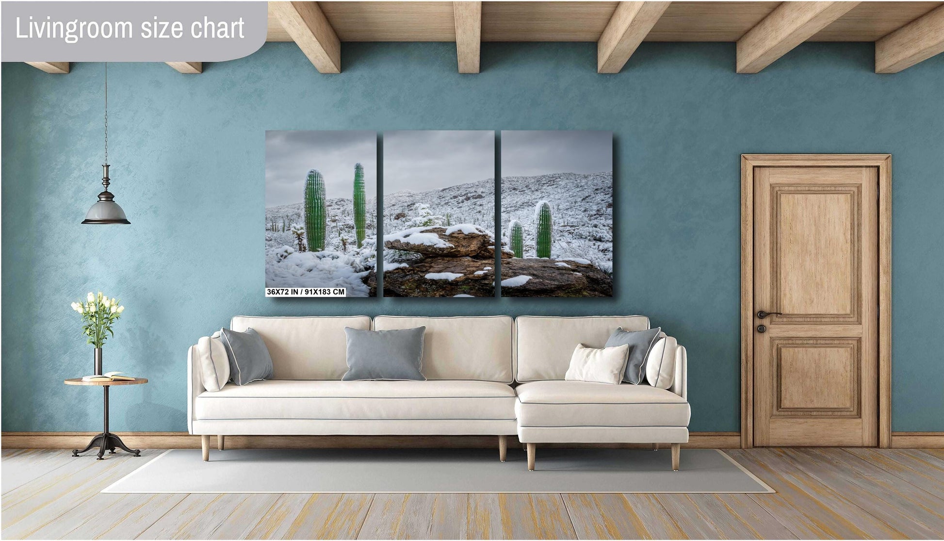 Snow-covered saguaro cacti in Saguaro National Park in Arizona surrounded by snowy desert hills and rocks.