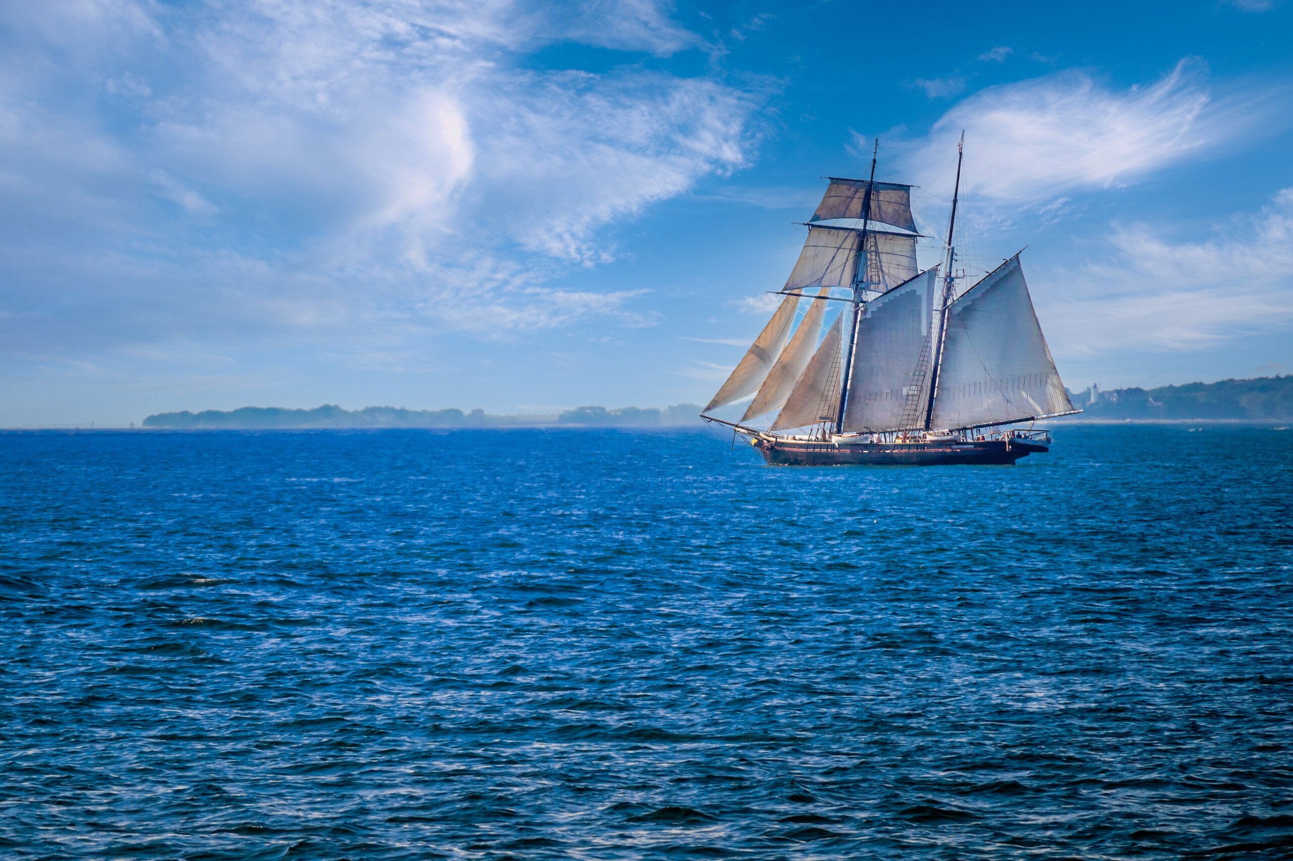 Sailing Past Martha’s Vineyard: Sailboat off Cape Cod’s Coast Sailing Past Martha’s Vineyard: Sailboat off Cape Cod’s Coast