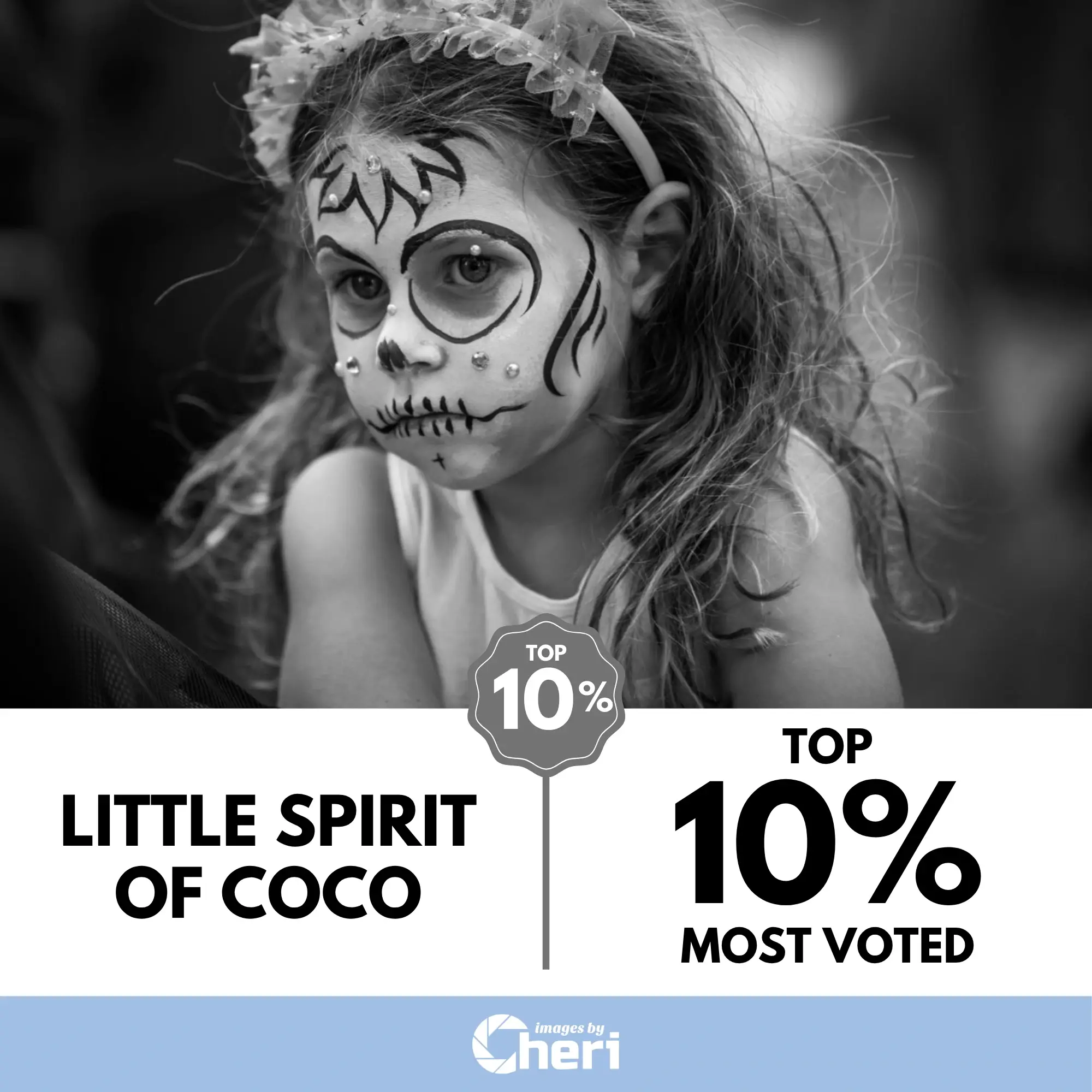 Close-up black and white portrait of a child with dramatic lighting and a powerful expression. Top 10% Most Voted in Photo Contest.