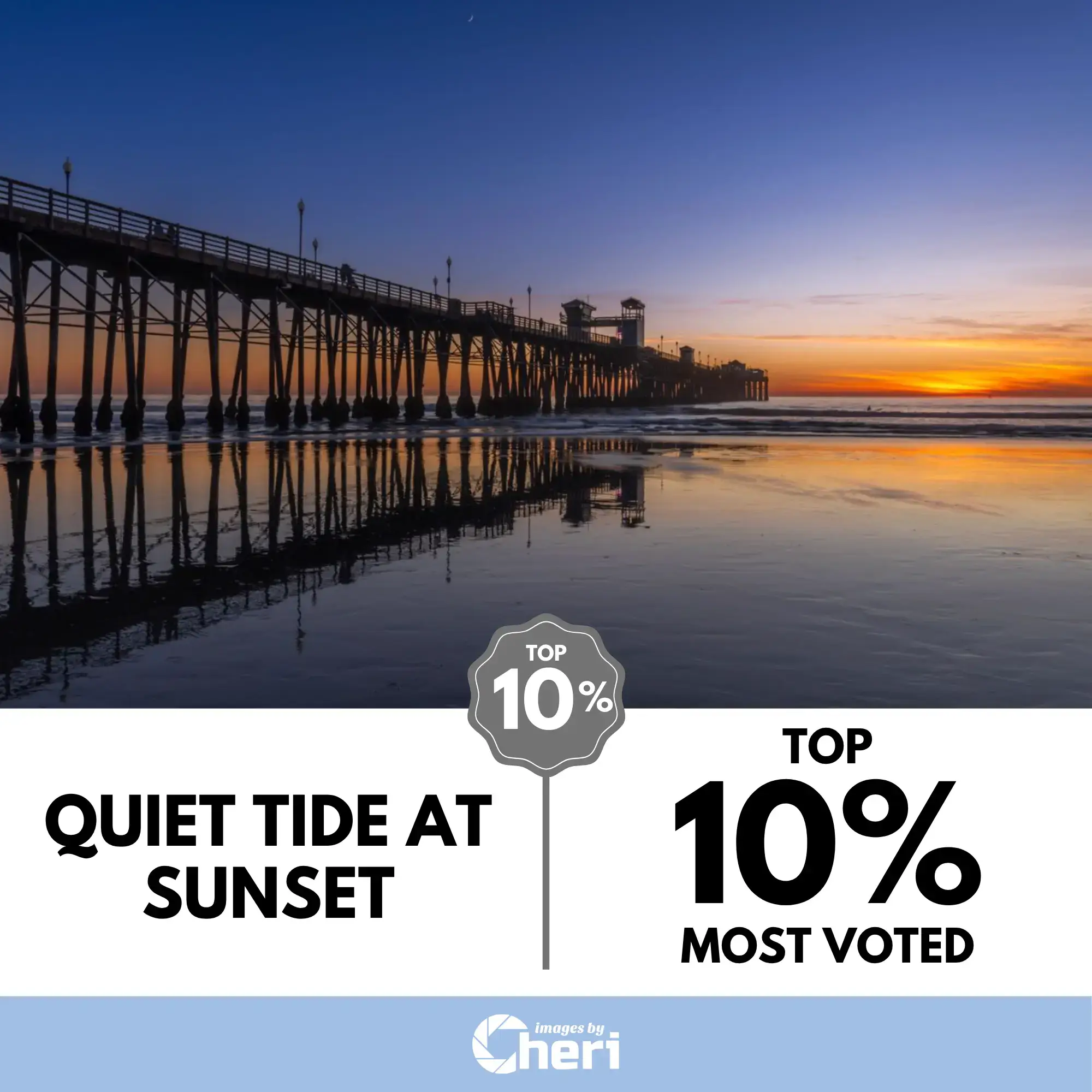 A long wooden pier at sunset in Oceanside, California, with the structure and sky reflecting on the wet beach sand. Top 10% Most Voted in Sunrise Hues Photo Contest.