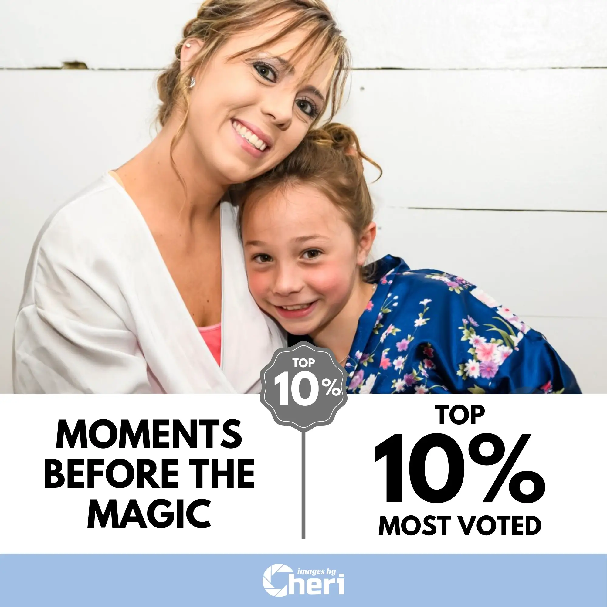 A smiling woman in a white robe hugging a young girl in a blue floral robe. Top 10% Most Voted in ‘People Frames Project Photo' Contest.