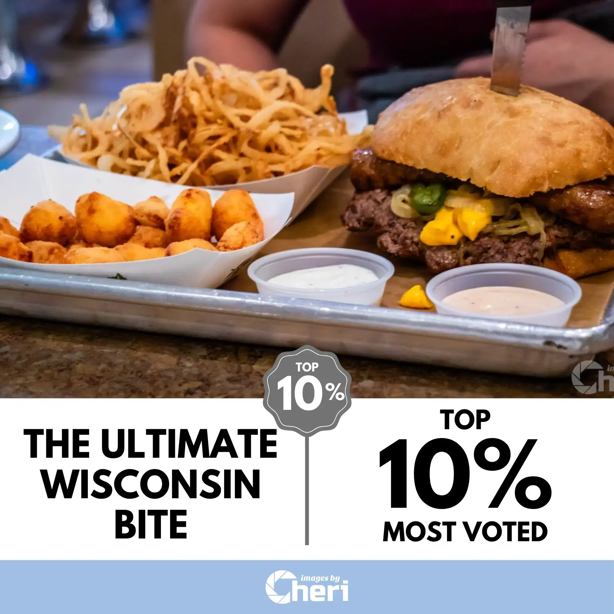 A large burger with melted cheese and peppers next to a tray of fried cheese curds and crispy onion strings. Viewbug.com: Top 10% Most Voted in ‘Foodie World Photo’ Contest