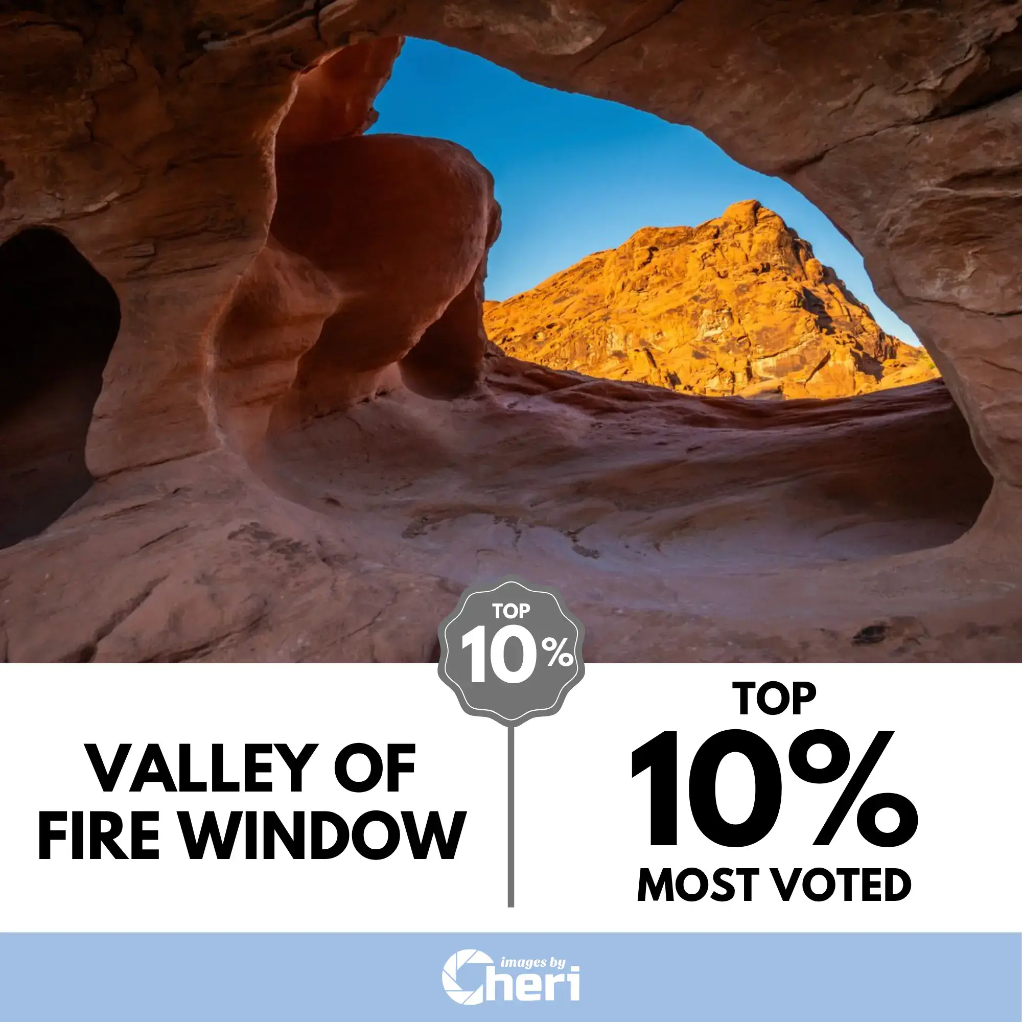 View of a sunlit red mountain peak framed perfectly by a natural, smooth rock opening inside a cave, Valley of Fire, Nevada. Top 10% Most Voted in 'Through the Lens Photo’ Contest.