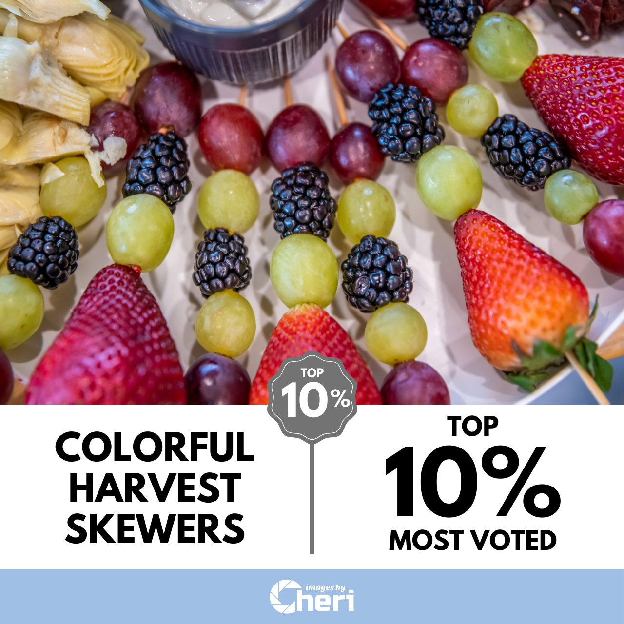 Close-up of fresh fruit skewers with strawberries, blackberries, and grapes titled "Colorful Harvest Skewers," ranked Top 10 Percent Most Voted.