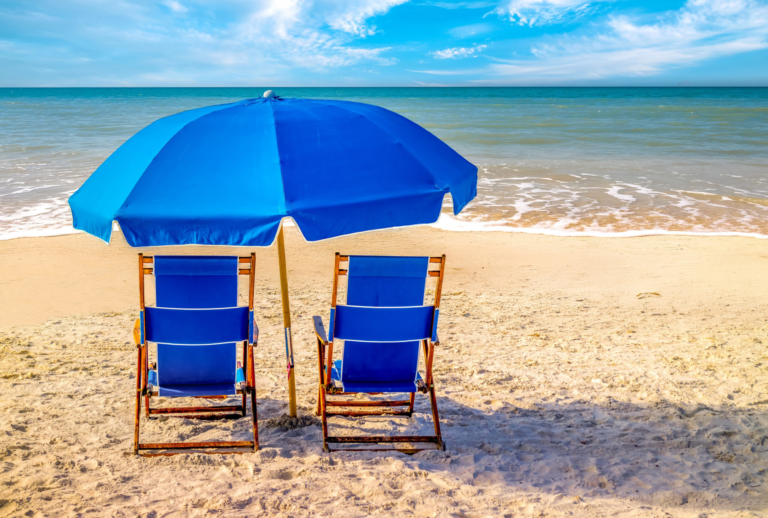 Fort Myers Beach Florida Blue Umbrella and Chairs Fort Myers Beach Florida Blue Umbrella and Chairs