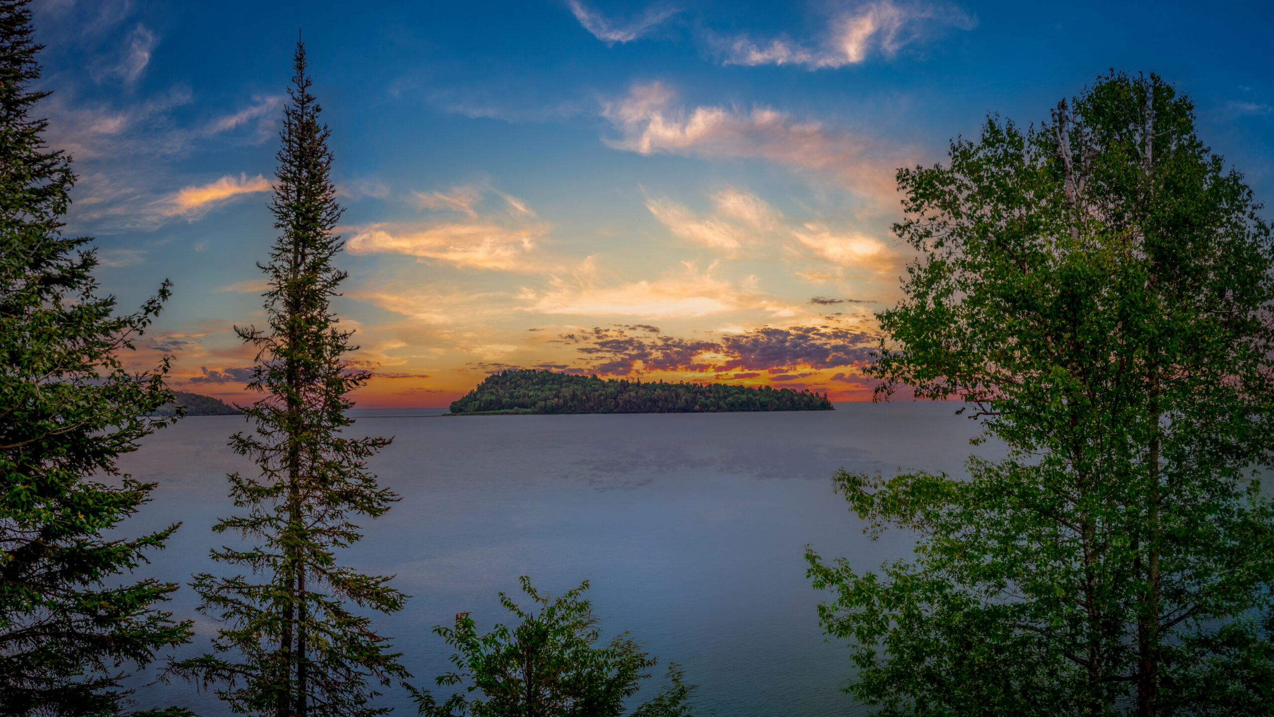 Lake Superior Island Sunset Through Forest Trees Lake Superior Island Sunset Through Forest Trees